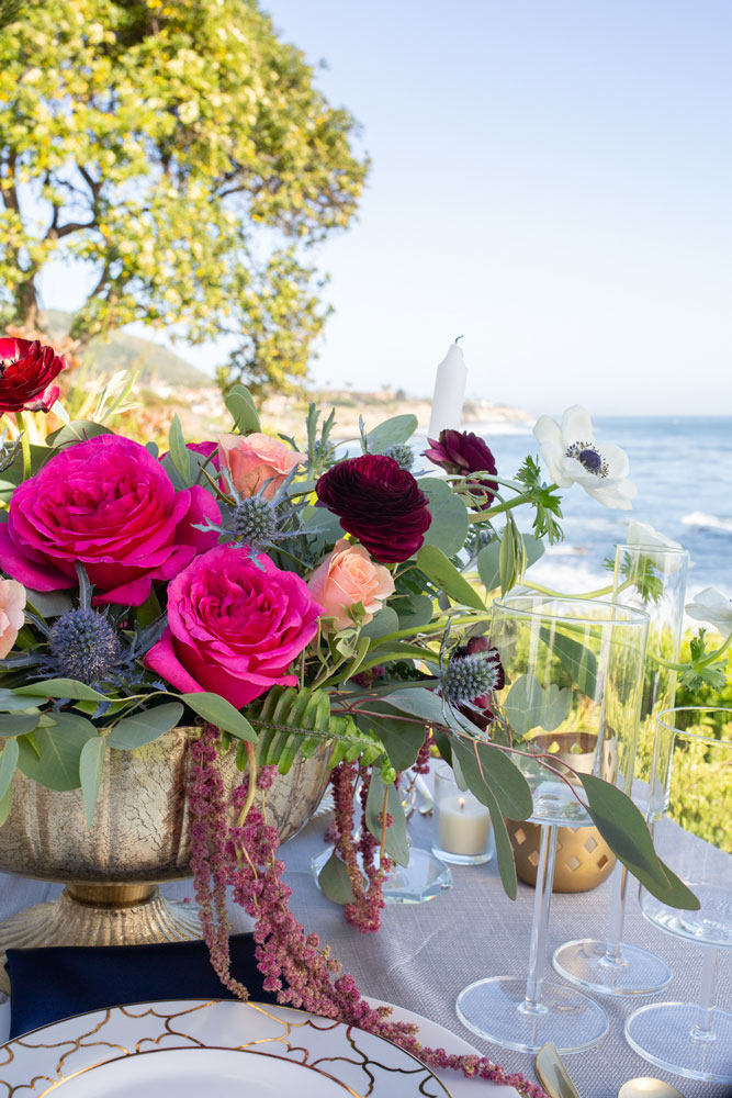 Queer SLO Renoda Campbell Photography flowers on table overlooking ocean